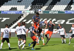 MAAIN PHOTO Elijah Adebayo rises above everybody but cannot direct a header at goal