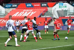 Elijah Adebayo deflects the ball into the net to level the score at 2-2