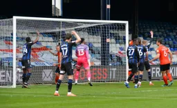 The ball is in the net and so is goal scorer Glen Rea