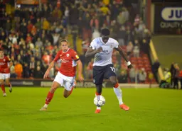 Elijah Adebayo drives forward with the ball
