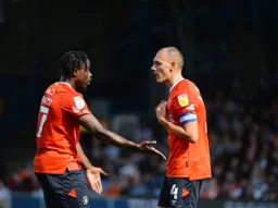 Pelly-Ruddock Mpanzu and Kal Naismith having a discussion on the pitch
