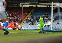 Luke Berry wants it more and gets the ball past future Hatter Thomas Kaminski