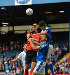 Sonny Bradley battling to win a ball sent in from a corner