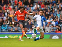 Gabe Osho gets the pass out while being closed down