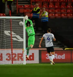 Simon Sluga sees the ball to safety