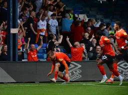 Luke Berry celebrates opening the scoring for the Hatters