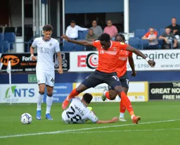 Elijah Adebayo avoiding obstacles in the box