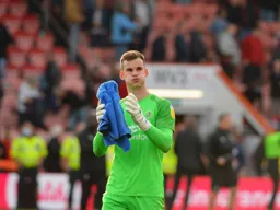 Simon Sluga applauds the travelling Hatters
