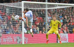Kal Naismith tries to keep the ball alive