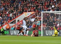 So close, Elijah Adebayo squeezes in between Adam Smith and Gary Cahill but just misses the target