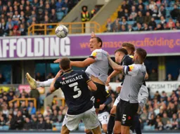 Kal Naismith tries to nod the ball on