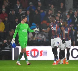 Simon Sluga and Elijah Adebayo wishing each other the best ahead of the match
