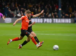 Jordan Clark battling in midfield