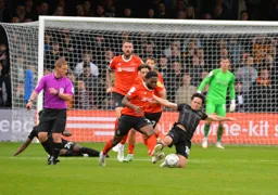 Fred Onyedinma bursts out of the Luton box with the ball