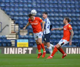 Tom Lockyer clearing the ball