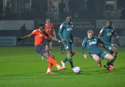 Elijah Adebayo has a shot at goal, putting Luton ahead
