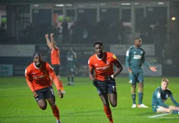 Elijah Adebayo wheels away with Pelly-Ruddock Mpanzu having put Luton ahead