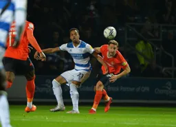 Tom Lockyer, tight to his marker and clearing the ball