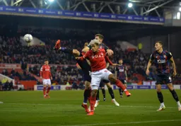 Jordan Clark battling in midfield as Kal Naismith looks on
