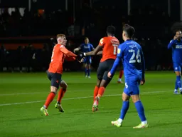 Elijah Adebayo and James Bree celebrating a late equaliser