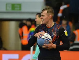 James Bree drying the ball before launching in a throw