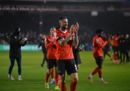 Sonny Bradley leading the applause for the home fans