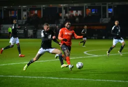 Fred Onyedinma chasing the ball down to keep the attack going