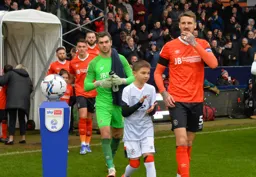 Sonny Bradley leads the team out ahead of the early kick off