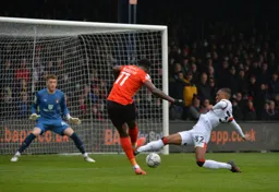 Elijah Adebayo has a shot at goal