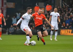 Allan Campbell about to go in hard on Ryan Christie