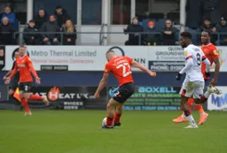 Allan Campbell drives a long range effort in