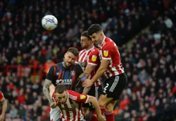 Captain Sonny Bradley up againt three Sheffield United defenders