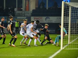 Goal mouth scramble. Elijah Adebayo and Kal Naismith are trying to force it over the line