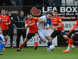 Allan Campbell battling to win the ball in midfield against Sam Gallagher
