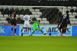 James Shea makes a save from close range with his feet