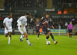 Gabe Osho dribbling upfield with the ball