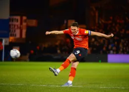 Kal Naismith thrashes a cross field ball