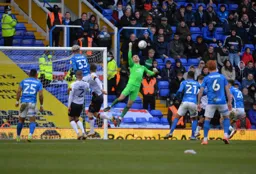 James Shea punches the ball away