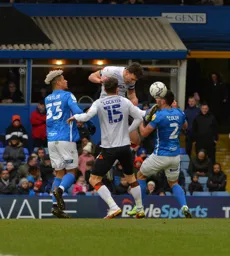 Kal Naismith and Tom Lockyer battling to win the ball