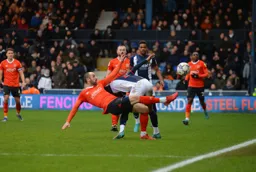 Danny Hylton trying the spectacular to keep the ball in play