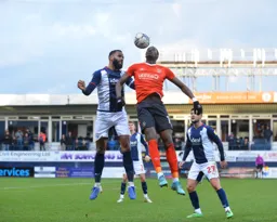 Elijah Adebayo battling with Kyle Bartley