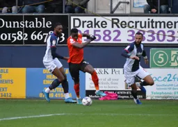 Elijah Adebayo cuts infield with the ball
