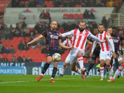 Danny Hylton controlling the ball, trying to carve out a chance
