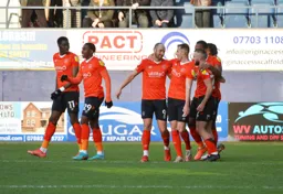 Danny Hylton gets congratulated by his team mates