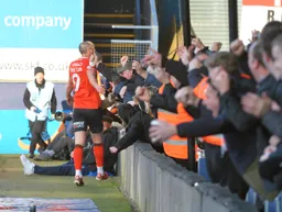 Danny Hylton getting the adulation from the Kenilworth Road End