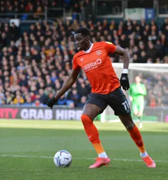 Elijah Adebayo about to charge forward with the ball