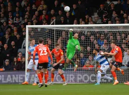 James Shea makes the punch to clear the danger