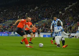 Danny Hylton trying to send the ball in, but his route is blocked
