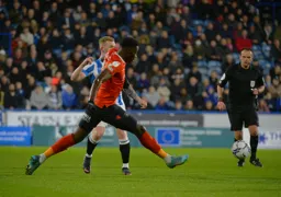 Elijah Adebayo trying to win the ball back with a high press