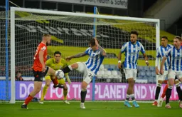 Allan Campbell trying to win the ball back in the Huddersfield box
